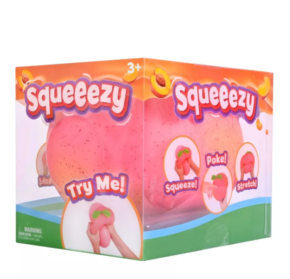 Pastel pink Squeezy brand peach sensory squishy toy with a matte finish